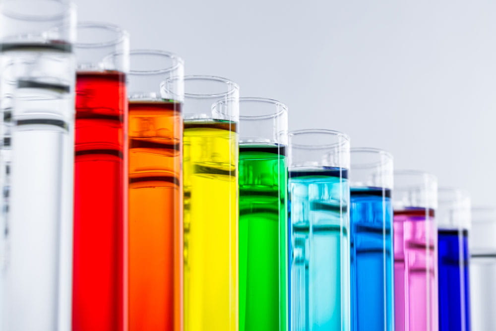 Series of test tubes with colorful liquids.