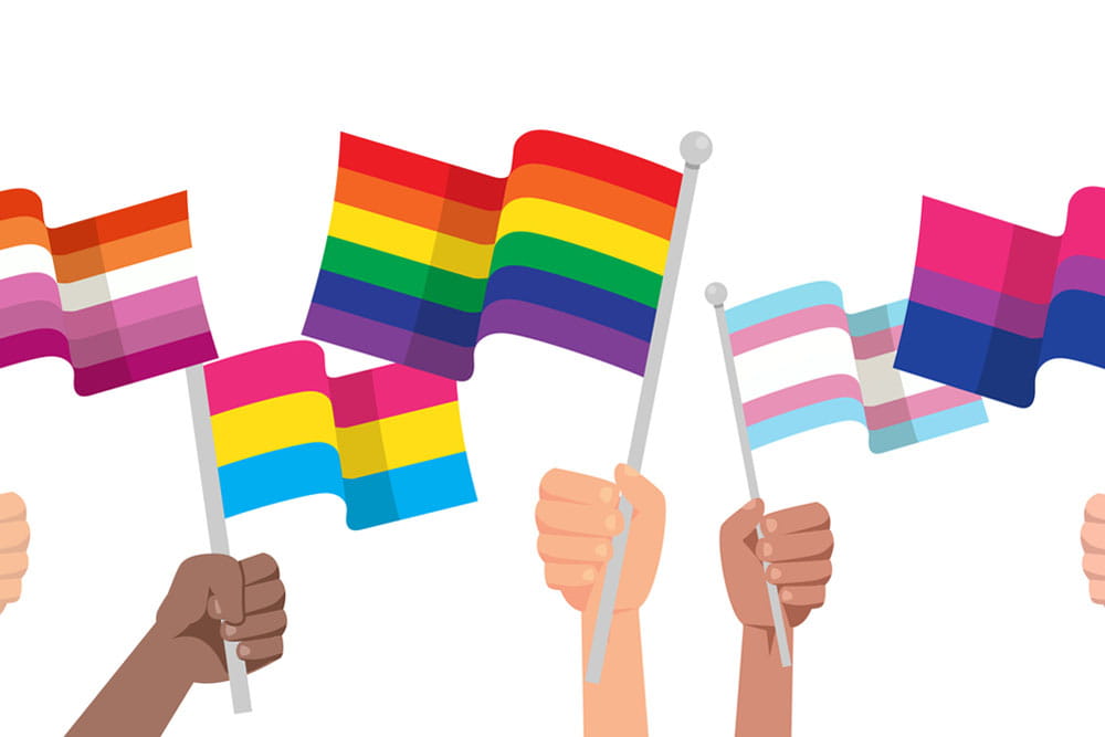 Hands with LGBTQ flag isolated on white background. Protesters, discriminations, human rights concept. LGBTQ community, pride month. 